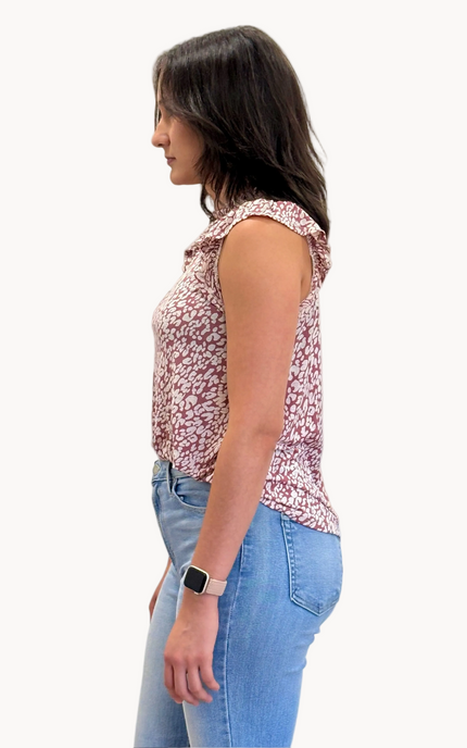 Ruffle Mock Neck Animal Print Top — sleeveless knit blouse with ruffle trim and keyhole back from Justyna Grace Boutique.