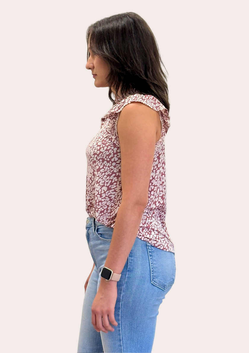 Ruffle Mock Neck Animal Print Top — sleeveless knit blouse with ruffle trim and keyhole back from Justyna Grace Boutique.