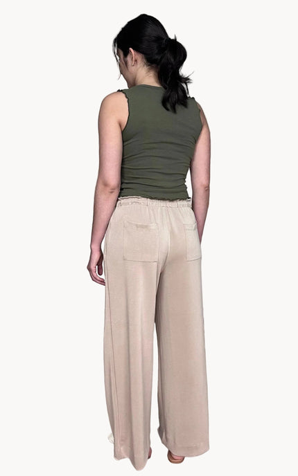 Back view of ruffle waist wide leg pants with back pocket detail
