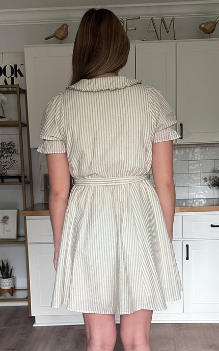 Back view of the Ruthie striped mini dress featuring elastic waistband and soft vertical stripes