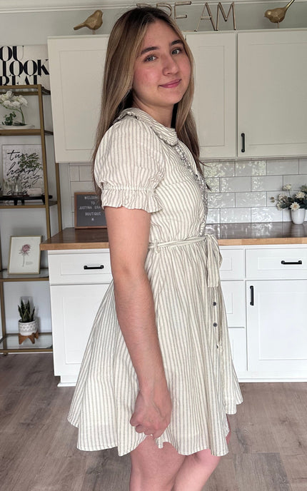 Side view of the Ruthie striped cotton mini dress showing ruffled doll collar and relaxed feminine fit