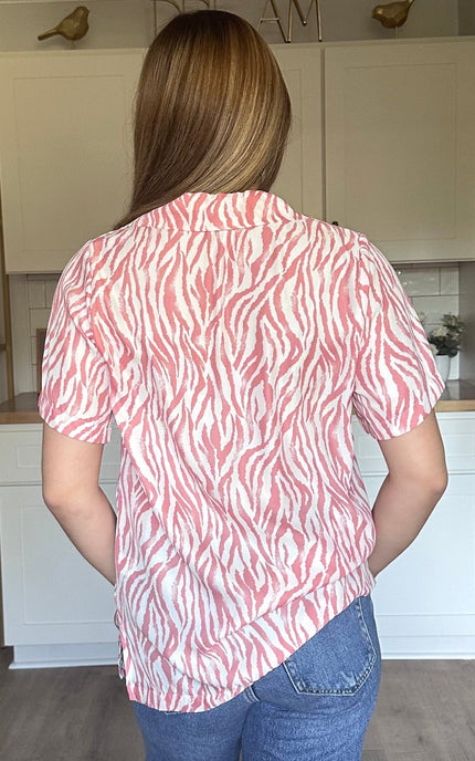 Coral zebra print Safari Lines Polo worn tucked