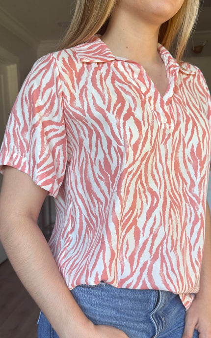 Coral zebra print Safari Lines Polo worn untucked