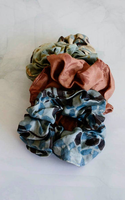 Hand-dyed satin finish scrunchies made from upcycled bandana fabric in soft earthy tones