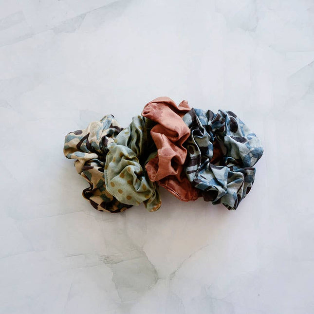Hand-dyed satin finish scrunchies made from upcycled bandana fabric in soft earthy tones
