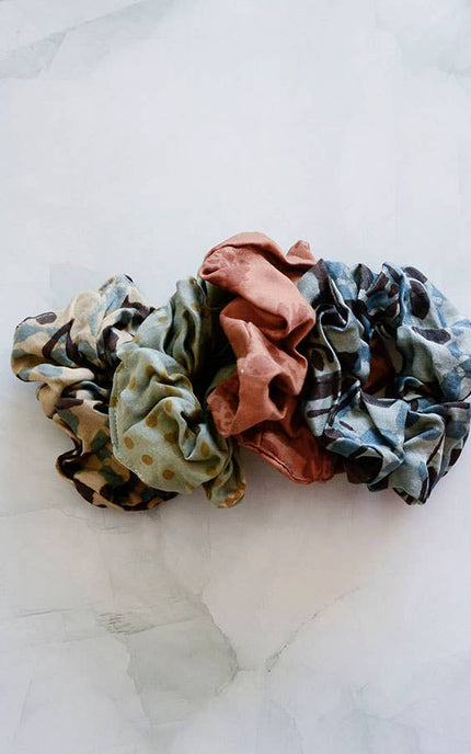 Hand-dyed satin finish scrunchies made from upcycled bandana fabric in soft earthy tones