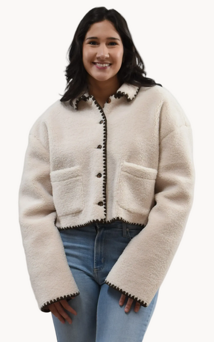 Cream Sherpa Stitch Jacket on soft linen background, featuring plush sherpa fabric and contrast stitching