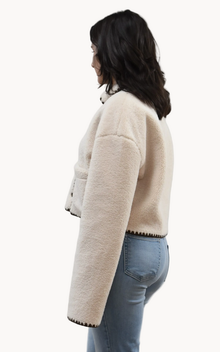 Cream Sherpa Stitch Jacket on soft linen background, featuring plush sherpa fabric and contrast stitching