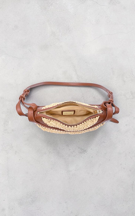 Interior view of Sloane Crescent Crossbody Bag showing compact compartment space