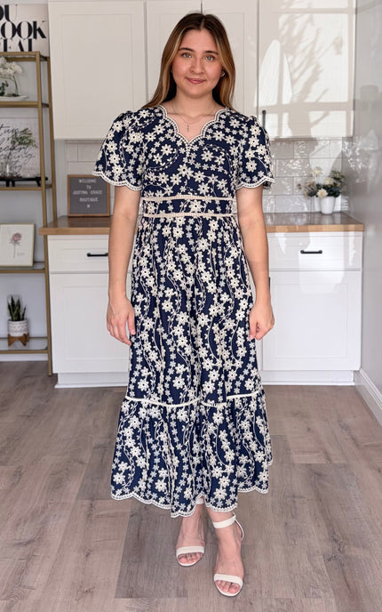Sloane embroidered cotton midi dress with floral embroidery and flowy silhouette