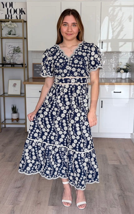 Sloane embroidered cotton midi dress with floral embroidery and flowy silhouette