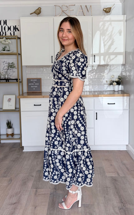 Side view of Sloane embroidered cotton floral midi dress with feminine flowy silhouette