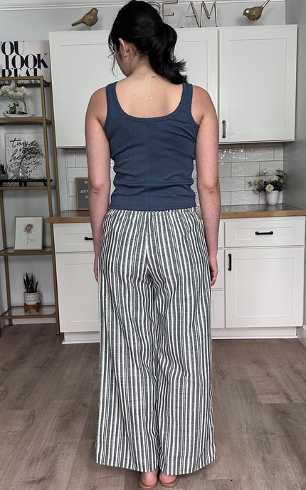 Back view of striped smocked linen wide leg pants with pull-on waistband