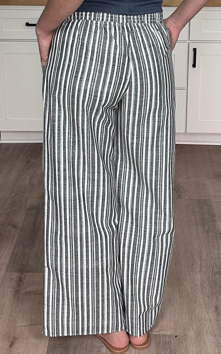 Back view of striped smocked linen wide leg pants with pull-on waistband