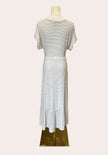 Soft ivory and gray striped midi dress with gentle ruffle hem — easy neutral style from Justyna Grace Boutique.