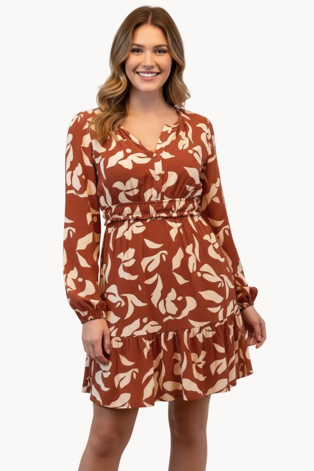 Woman wearing a brown floral dress on a white background