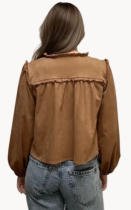 Brown suede-inspired cropped jacket top with ruffle trim, front cut-out, and balloon sleeves, shown on a soft-linen background for a cozy fall look.