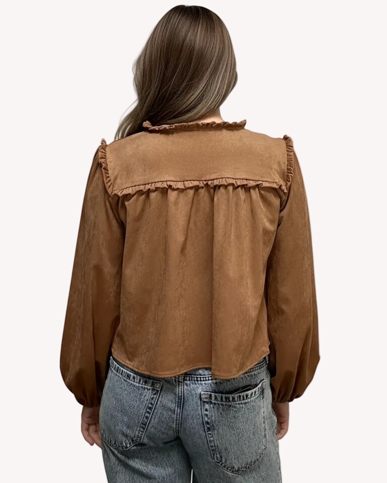Brown suede-inspired cropped jacket top with ruffle trim, front cut-out, and balloon sleeves, shown on a soft-linen background for a cozy fall look.