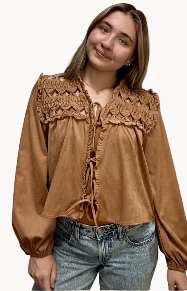 Brown suede-inspired cropped jacket top with ruffle trim, front cut-out, and balloon sleeves, shown on a soft-linen background for a cozy fall look.