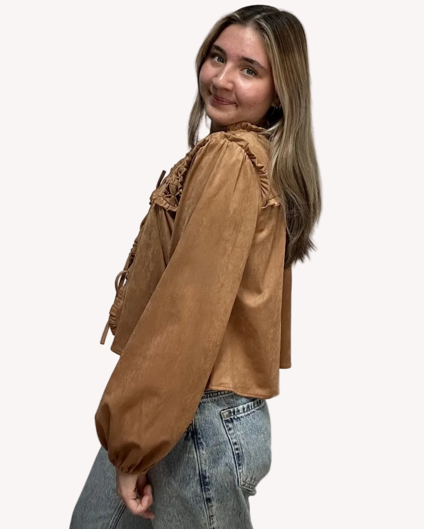 Brown suede-inspired cropped jacket top with ruffle trim, front cut-out, and balloon sleeves, shown on a soft-linen background for a cozy fall look.