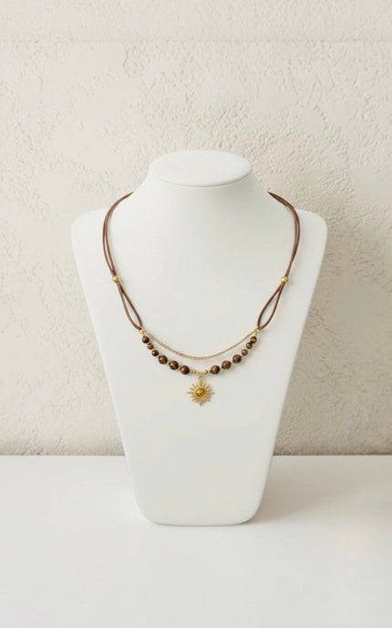 Lightweight sun necklace shown at actual scale next to size reference