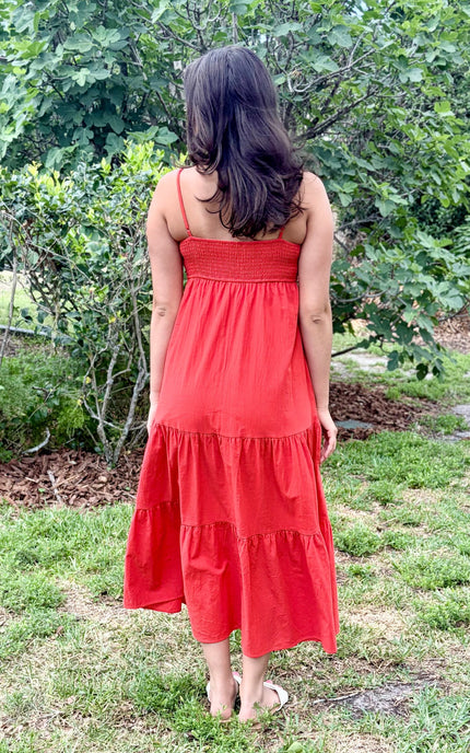 Back view of cotton maxi dress showing smocked back panel and tiered skirt
