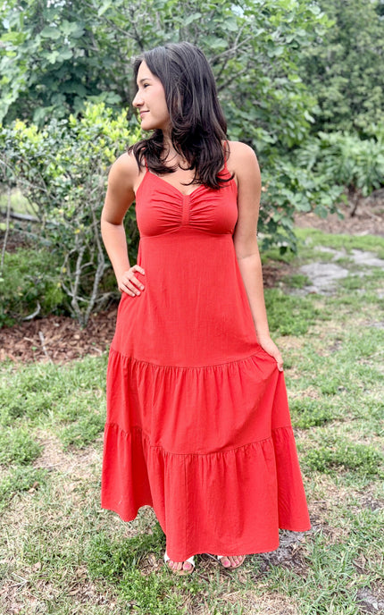 Cotton maxi dress with sweetheart neckline, ruched bodice, and tiered skirt design