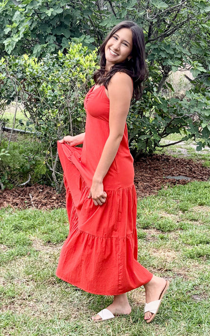 Lightweight cotton maxi dress catching breeze, displaying layered skirt movement