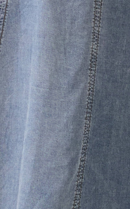 Macro view of the 100% Tencel material, emphasizing the fabric's natural sheen and breathable, silk-like texture.
