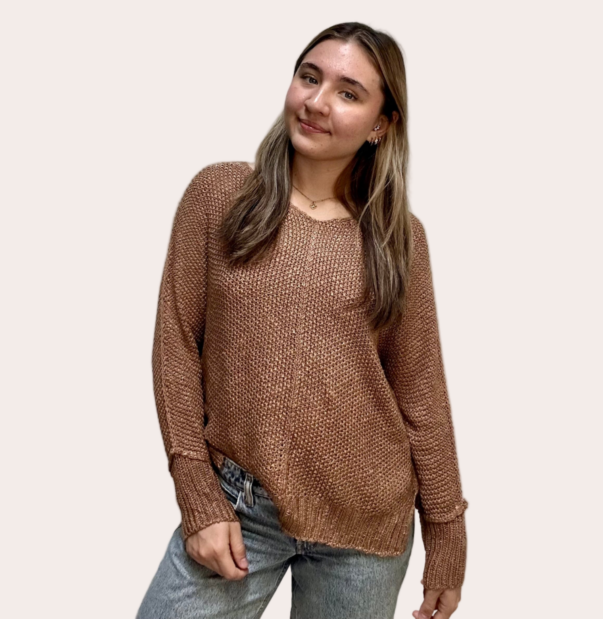 Textured knit V-neck sweater with hi-lo hem, side slits, and relaxed draped fit, shown on model 5'7 wearing size S/M in soft neutral lighting