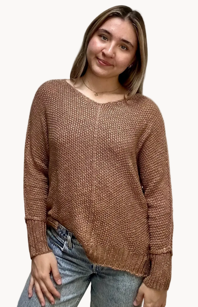 Textured knit V-neck sweater with hi-lo hem, side slits, and relaxed draped fit, shown on model 5'7 wearing size S/M in soft neutral lighting