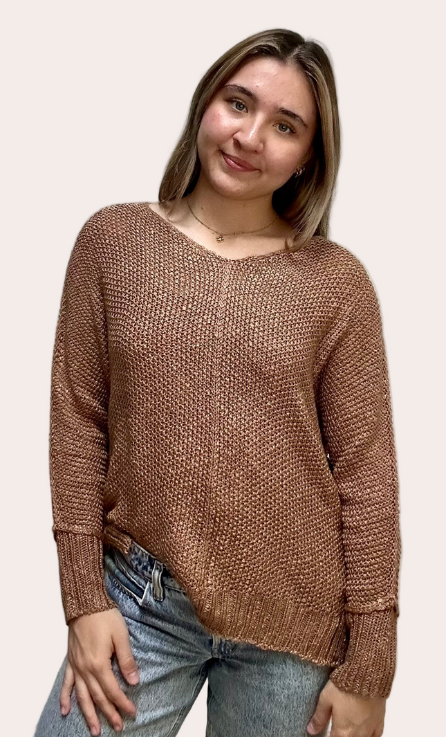 Textured knit V-neck sweater with hi-lo hem, side slits, and relaxed draped fit, shown on model 5'7 wearing size S/M in soft neutral lighting