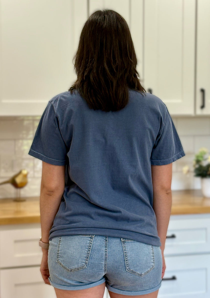 Comfort Colors “A Lot Can Happen in Three Days” Easter tee with cross and peony design, soft cotton, and relaxed unisex fit.