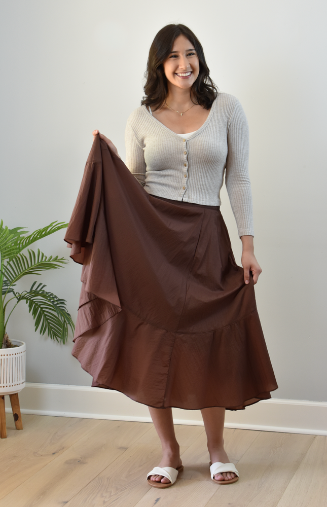 Tiered A-Line Midi Skirt — crisp structured midi with high-fitted waistband and gathered silhouette from Justyna Grace Boutique.