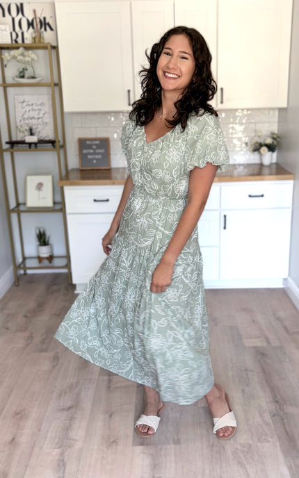 Accommodating everyday midi dress with relaxed fit, elastic waist, and tiered silhouette