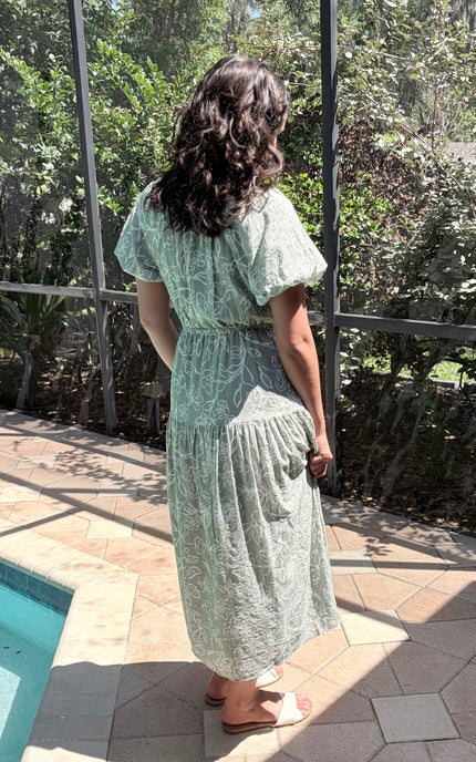 Back of soft cotton-rayon dress displaying tiered skirt layers and construction quality