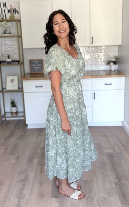 Side view of tiered midi dress showing layered skirt and flattering silhouette