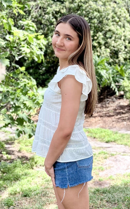Side view of tiered ruffle top with soft drape