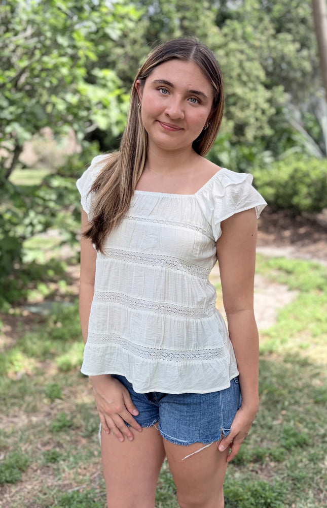 Tiered ruffle top with square neckline and flutter sleeves front view