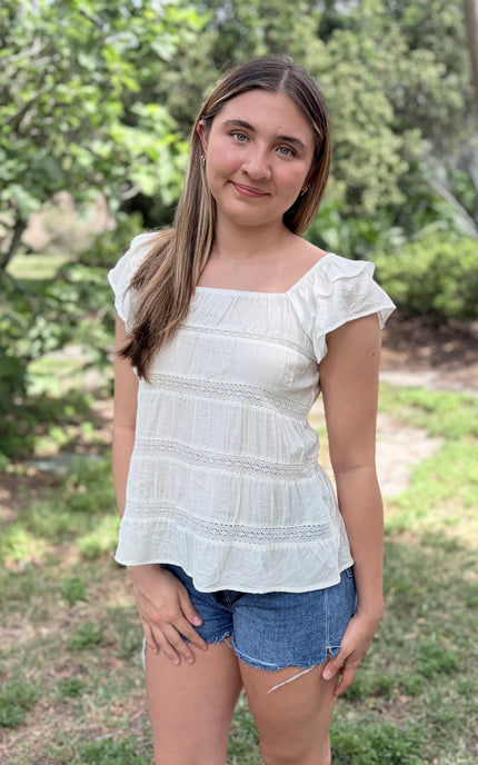 Tiered ruffle top with square neckline and flutter sleeves front view