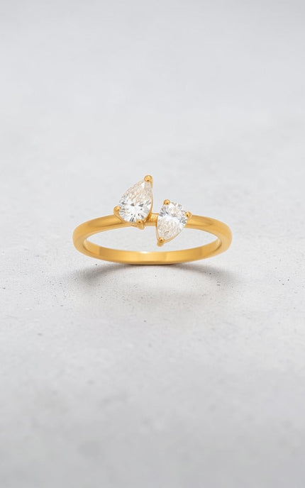 Detailed view of teardrop-cut crystal detail on delicate gold band