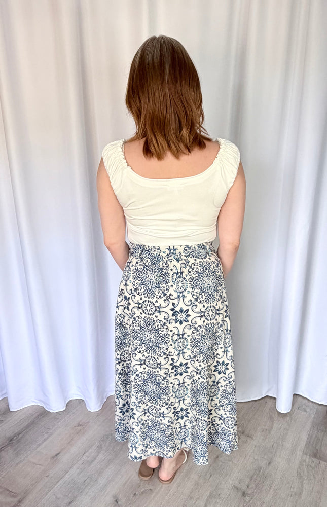 Back view of the Valencia Tile Midi Skirt showing the comfortable elasticated waistband and the flowy A-line silhouette.