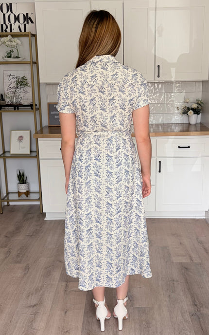 Back view of Valerie floral cotton shirt dress with rolled sleeves and self-tie waist belt