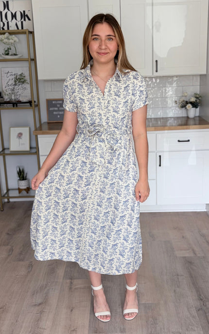 Front view of Valerie floral cotton shirt dress with rolled sleeves and self-tie waist belt