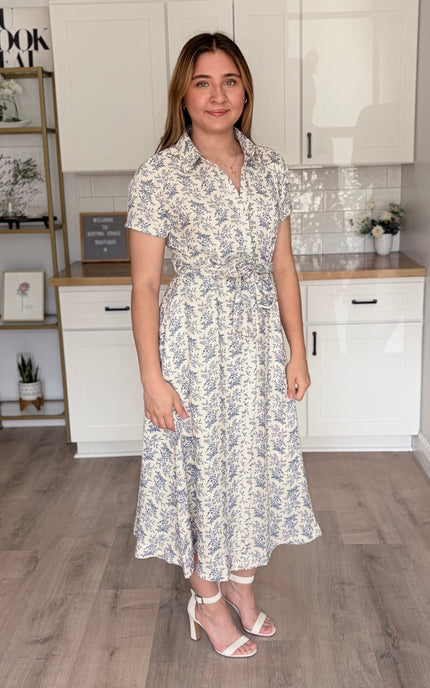 Side view of Valerie floral cotton shirt dress with rolled sleeves and self-tie waist belt