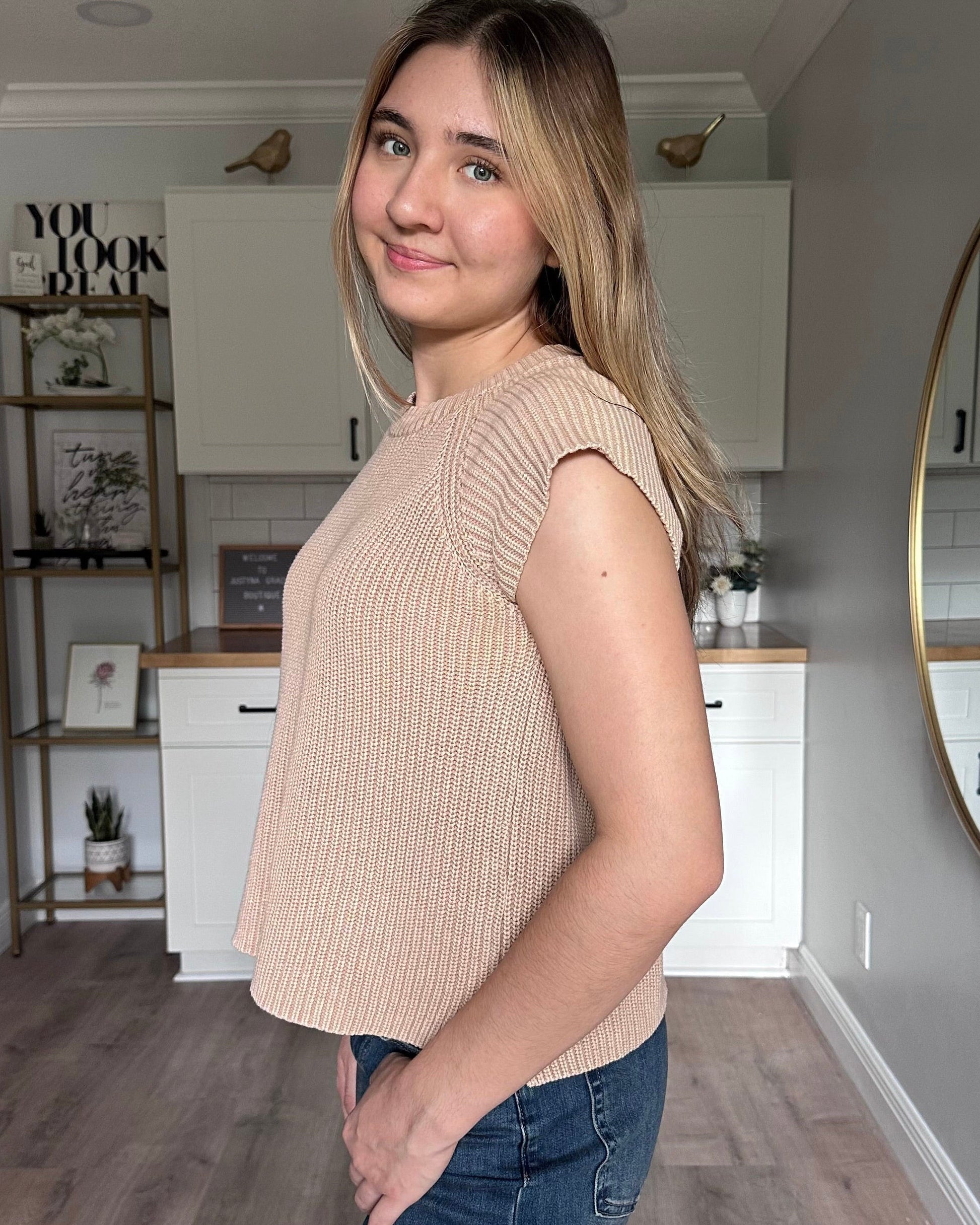 Side view of the everyday sweater tee highlighting short sweater sleeves and breathable cotton knit