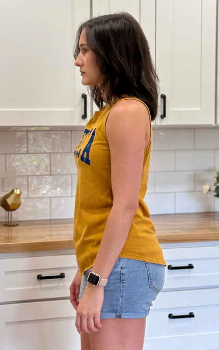 Model wearing vintage Americana cotton graphic tank in size medium