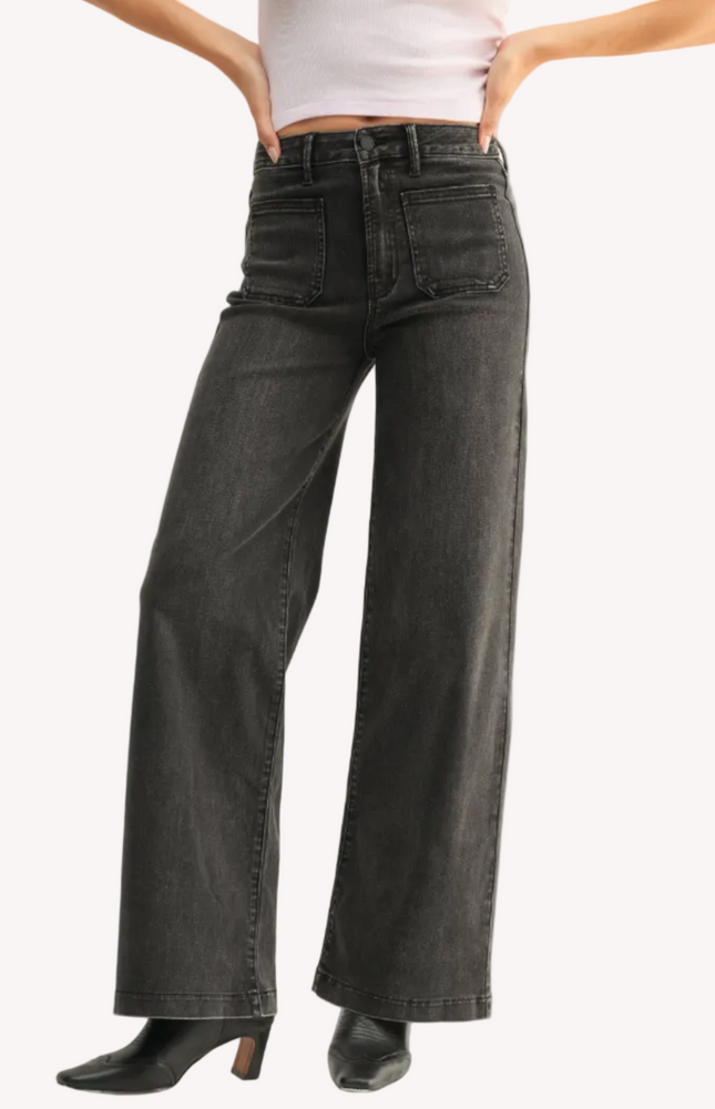 Vintage-inspired dark-wash denim overalls with adjustable straps — relaxed and timeless from Justyna Grace Boutique.