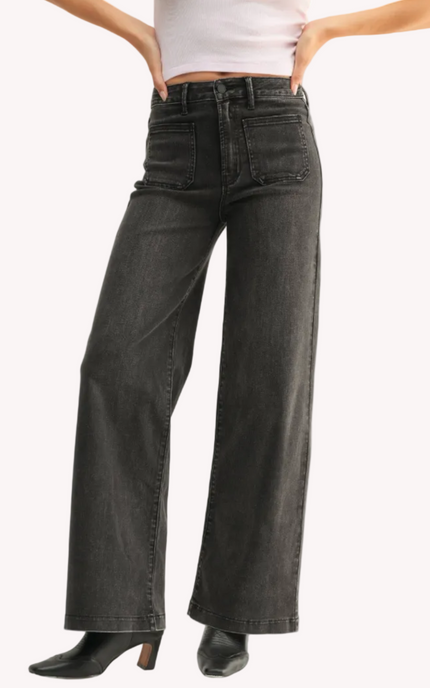 Vintage-inspired dark-wash denim overalls with adjustable straps — relaxed and timeless from Justyna Grace Boutique.