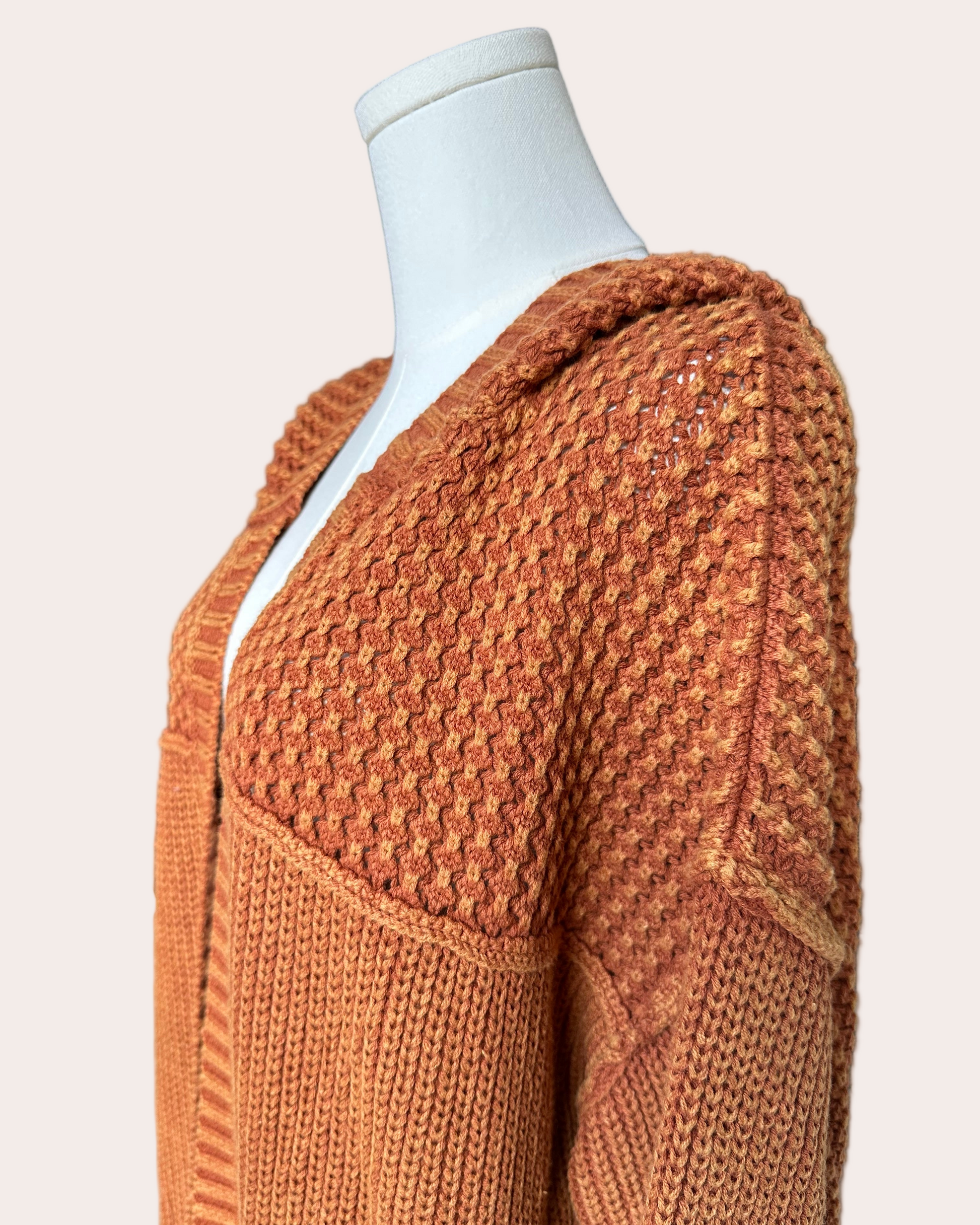 Washed 100% cotton hooded cardigan with a relaxed, cozy fit, shown in a soft neutral tone against a clean soft-linen background for an easy layered look.